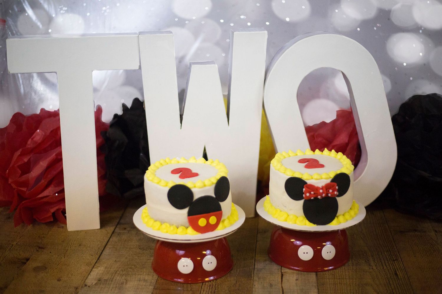 Two Mickey and Minnie Mouse themed birthday cakes for a TWO birthday celebration.
