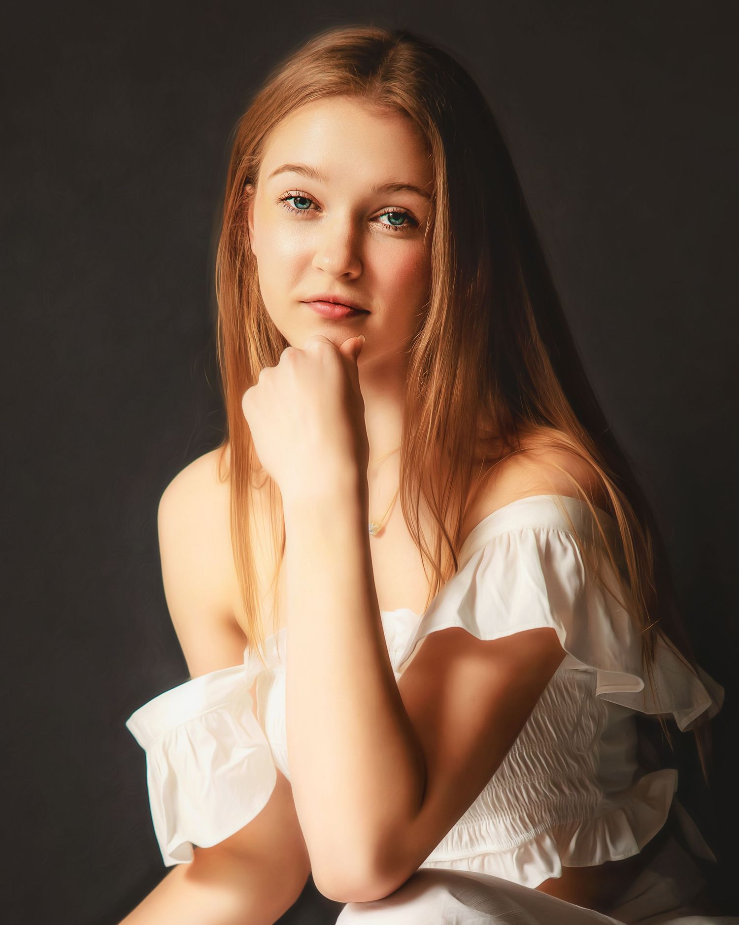 Portrait against dark background shows person in white off-shoulder top with flowing strawberry blonde hair and dreamy expression.
