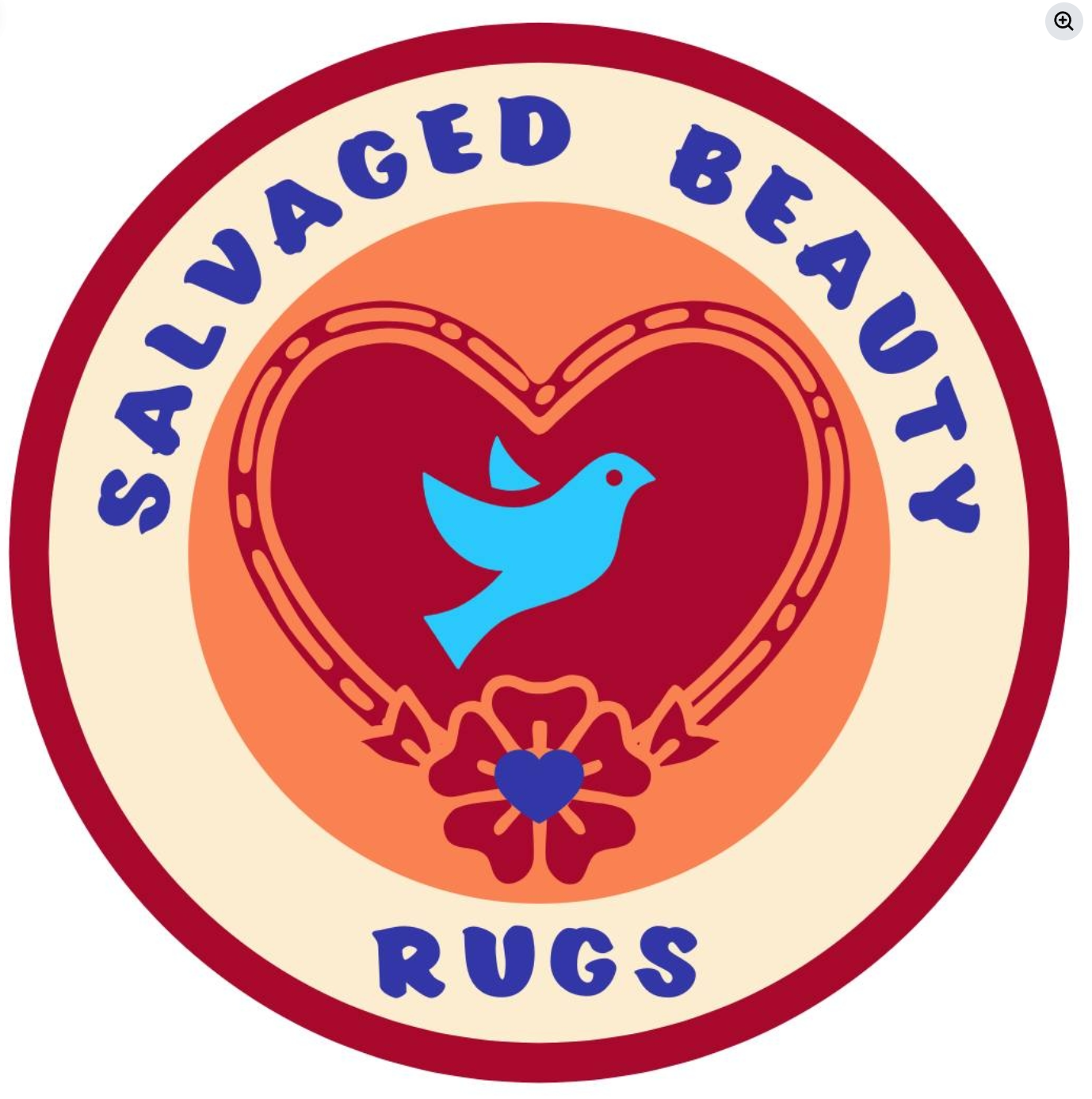 Salvaged Beauty Rugs circular logo featuring a blue dove, red heart, and floral design on a cream and orange background.