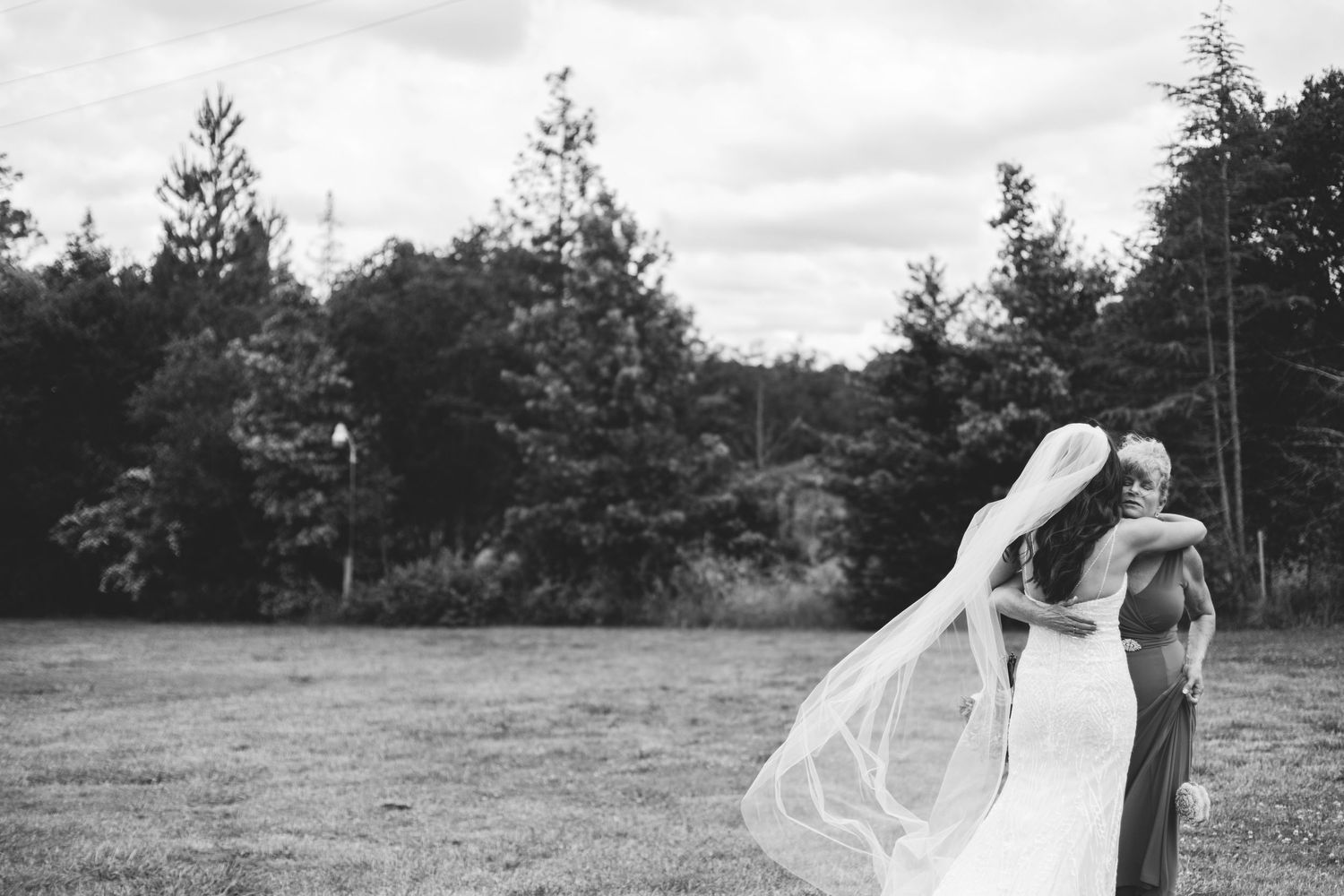 Bride and mother embrace