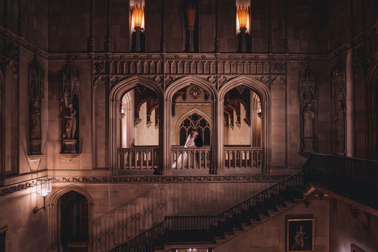 Gothic architecture frames a romantic wedding scene with dramatic lighting.