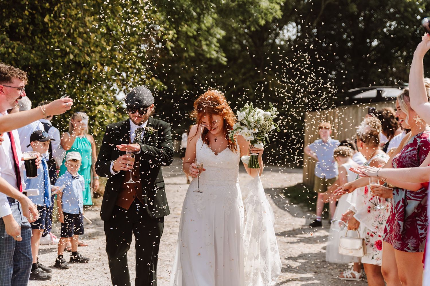 Cerne Abbas Brewery wedding. Confetti shot. Rustic wedding decorations. Dorset Candid wedding photographer