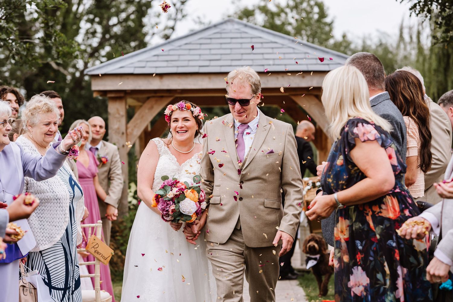 Confetti photograph at the Waterside Country barn and Mill a lakeside wedding venue near Taunton