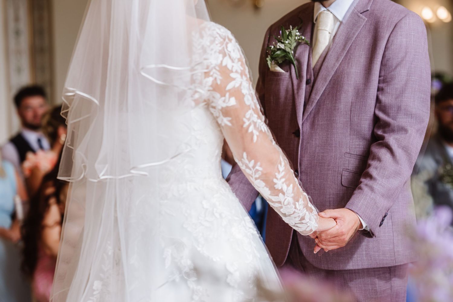 Bride and groom hold had during their wedding at Kingston Maurward Estate Wedding. Relaxed Dorset Wedding photographer