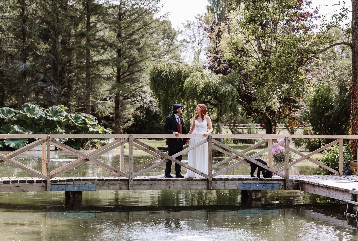 Bride and Groom in lake near Dorchester.  Dorset Candid wedding photographer