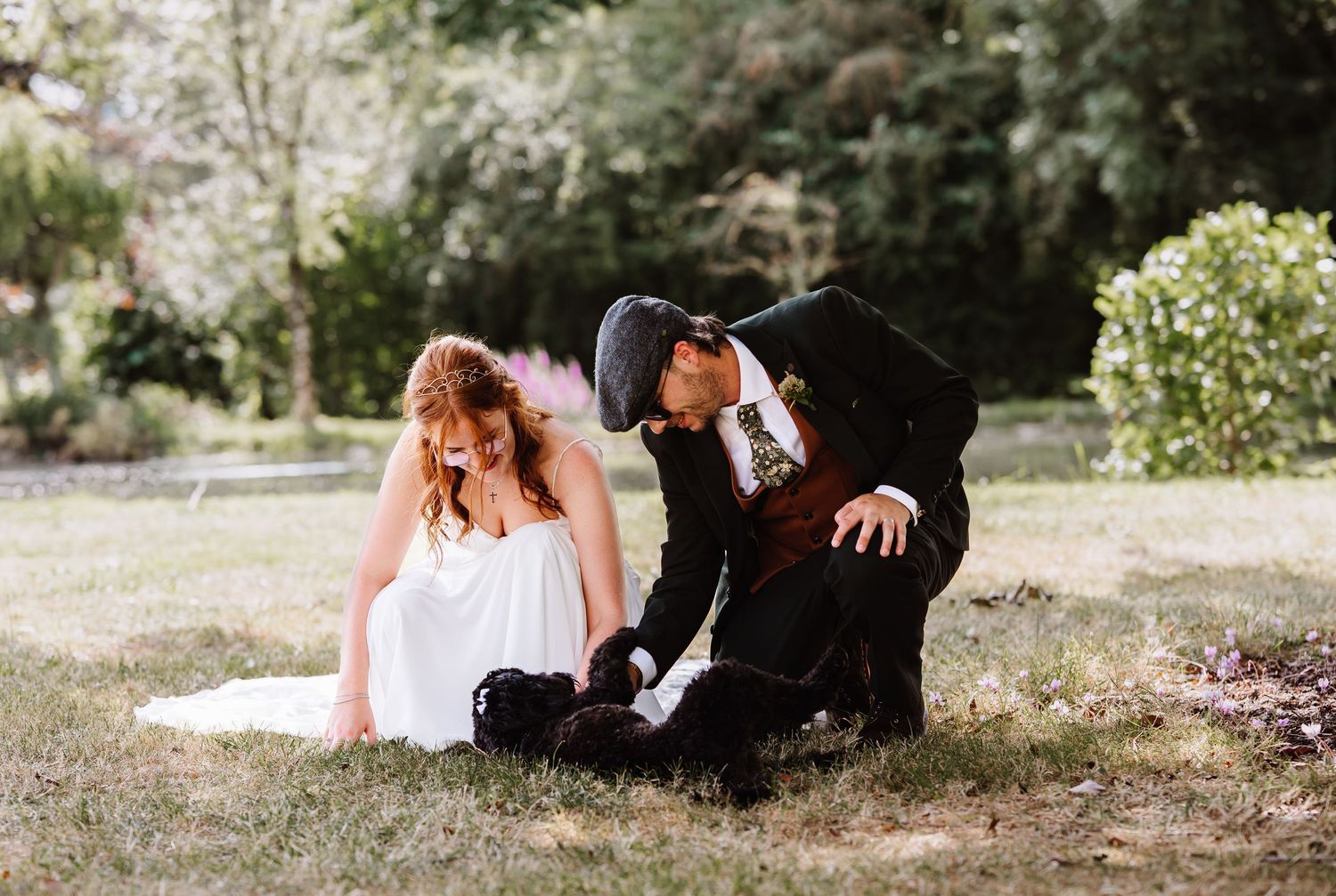Bride and Groom with dog at Dorset Festival barn wedding at Cerne Abbas Brewery. Candid photos from a relaxed Dorset wedding photographer