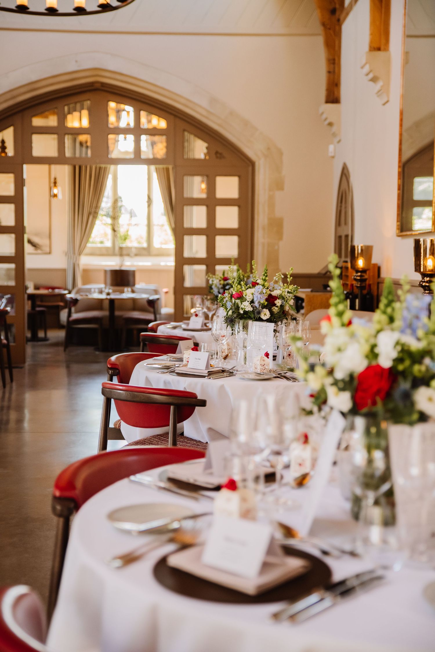Red and Blue wedding decorations at The Clockspire, Milborne Port wedding venue Dorset. Dorset Candid wedding photographer