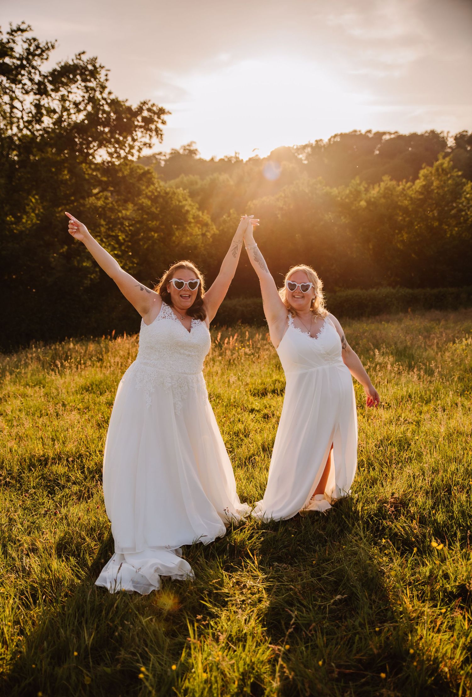 Weymouth wedding photographer. LGBTQ+ Dorset wedding at The Gaggle of Geese, near Dorchester. Golden hour meadow photography
