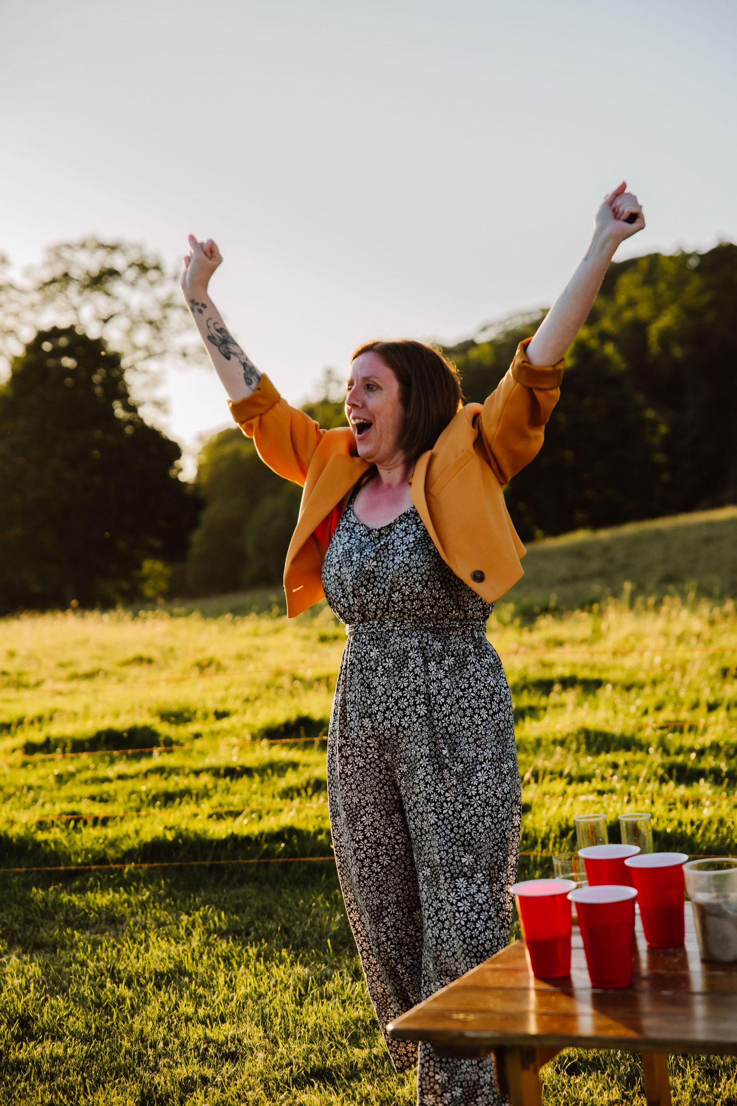 Weymouth wedding photography at Fonthill Estate Wiltshire Candid wedding photographer. Beer pong at the Fonthill Estate Deer Barn