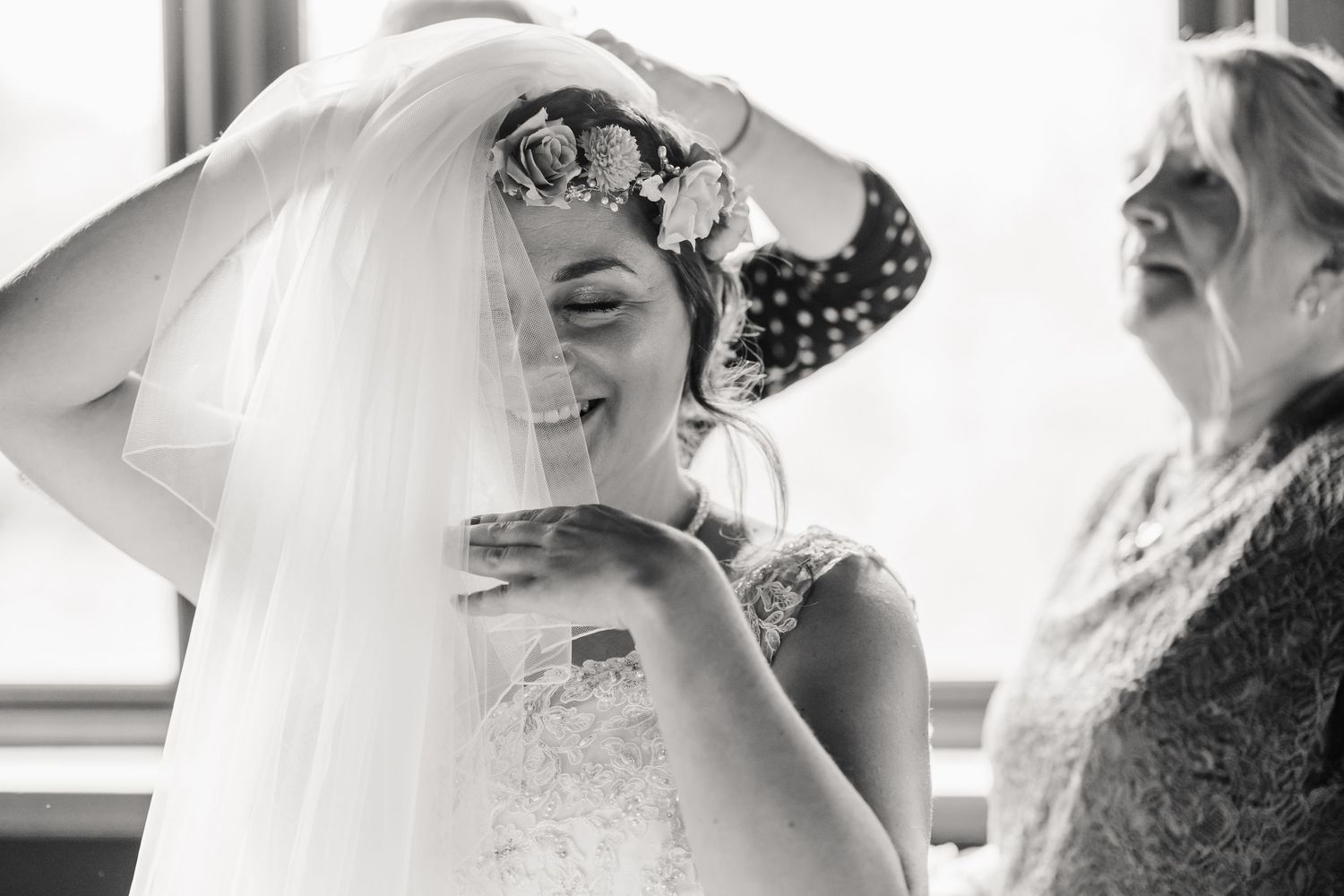Bride at the Waterside Country Barn and Mill, Taunton Outdoor Barn wedding venue with lake. Candid wedding photographer Somerset