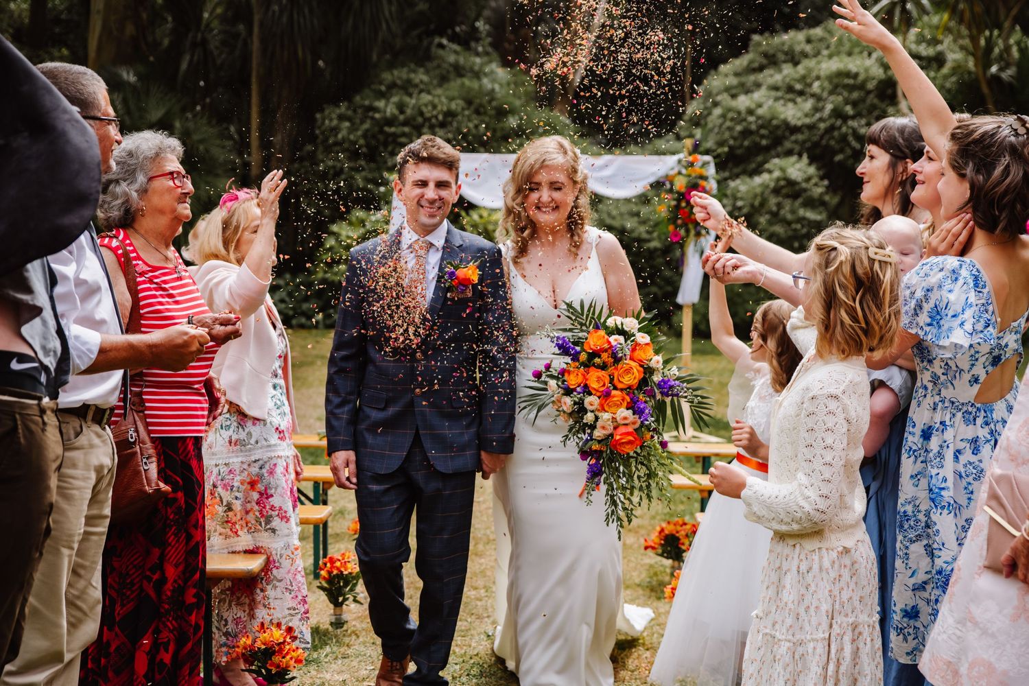 Confetti shot at an Abbotsbury Subtropical Garden wedding. Outdoor wedding venue in Dorset, Candid Weymouth wedding photographer