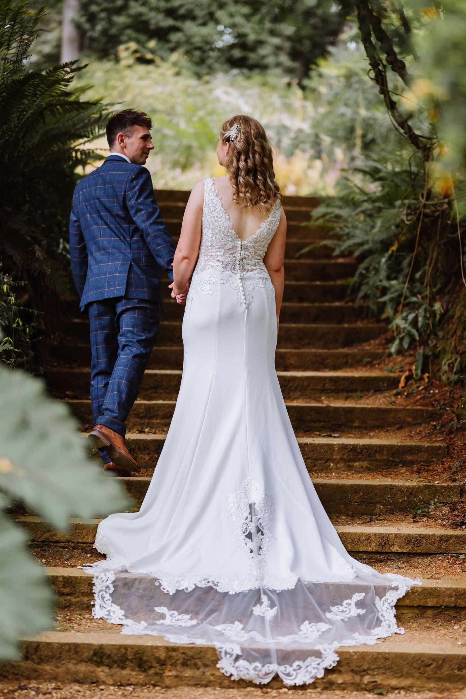 Bride and groom at a Abbotsbury subtropical Gardens wedding. Outdoor wedding venue in Dorset,  Candid Weymouth wedding photographer