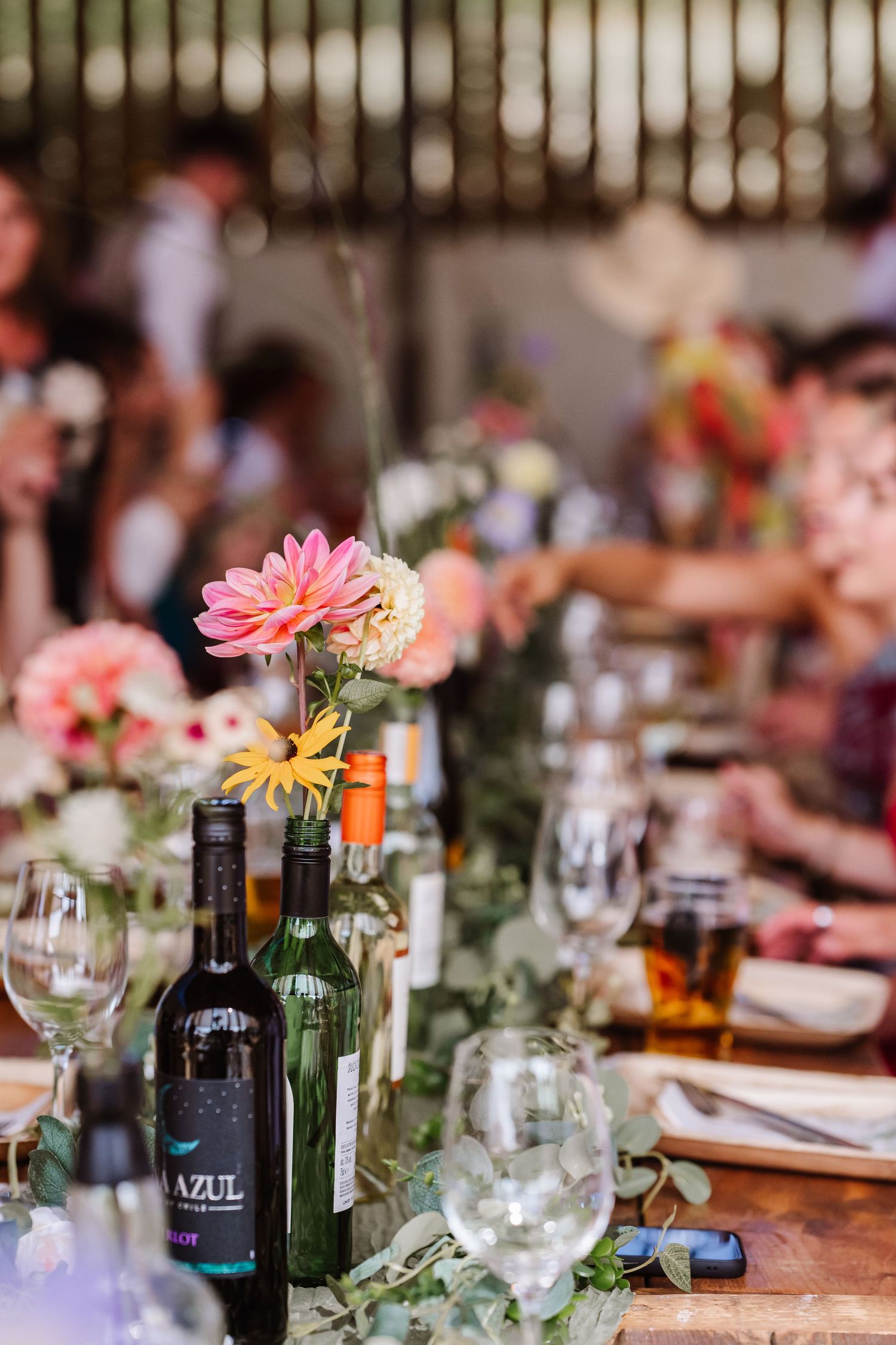 Boho flowers at Dorset Festival barn wedding at Cerne Abbas Brewery. Candid photos from a relaxed Dorset wedding photographer