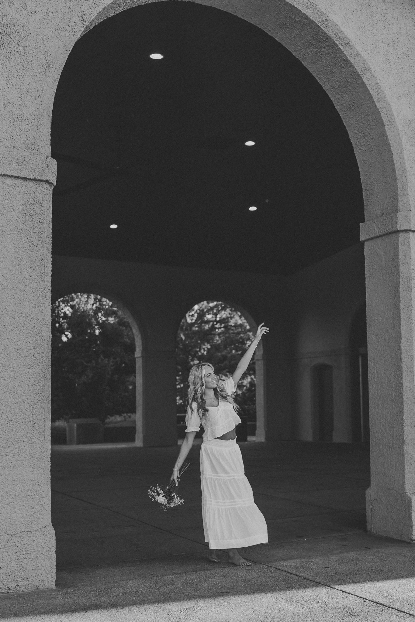 senior girl forest park pavilion big orange rust color arched doorway black and white photo