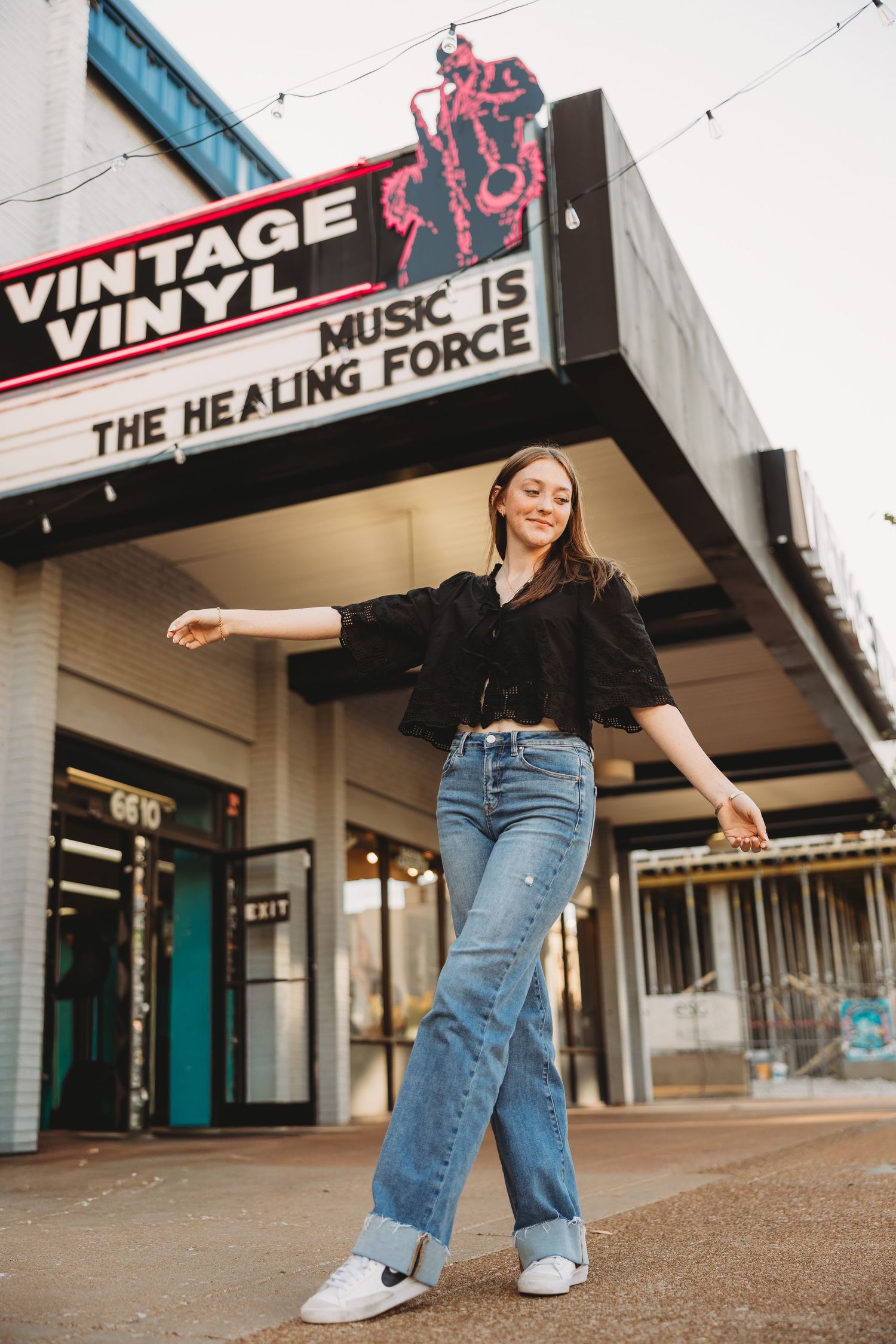 senior vintage vinyl Delmar loop blue jeans black shirt redhead