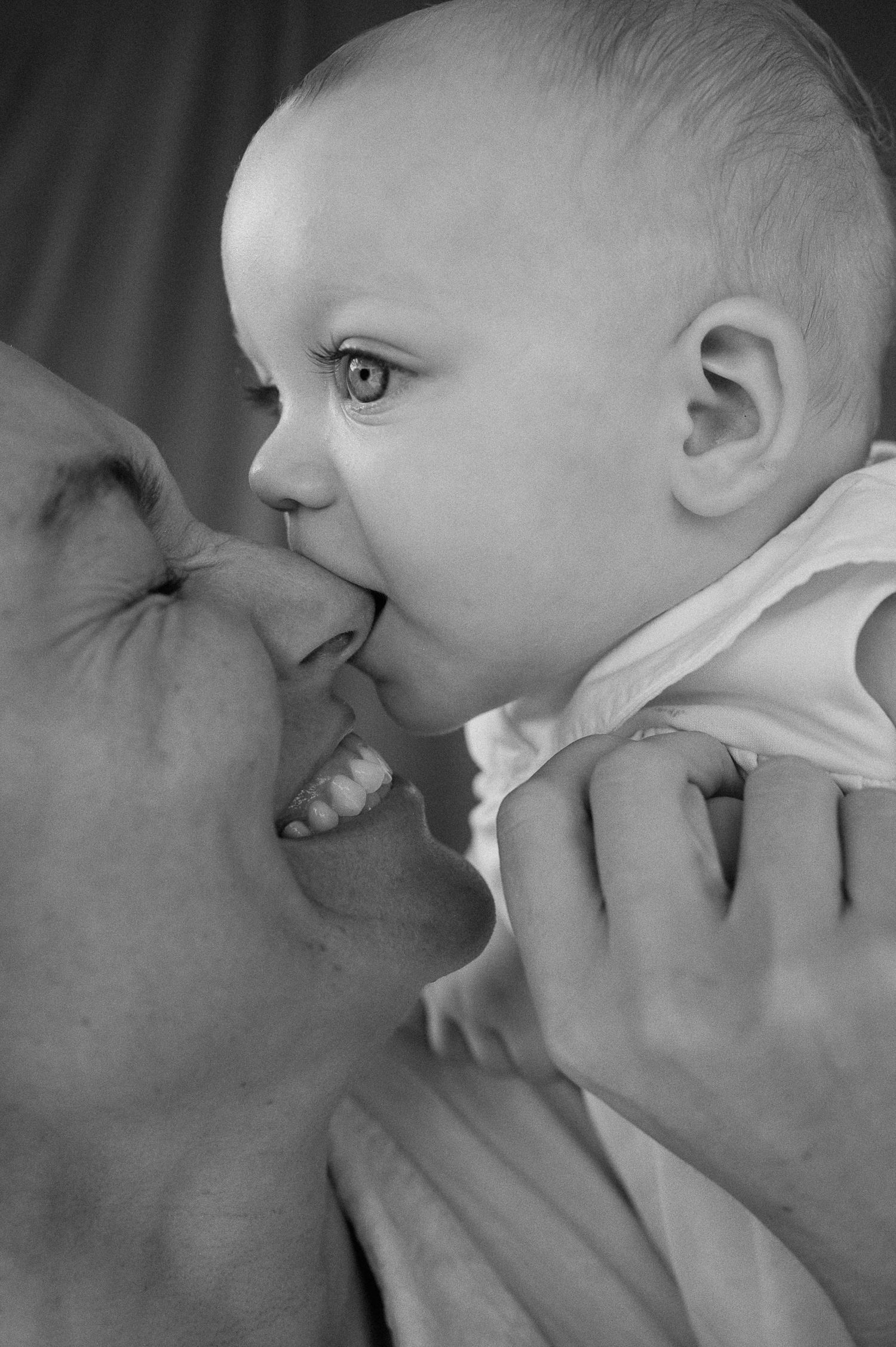 Close-up black and white portrait capturing intimate bonding moment.