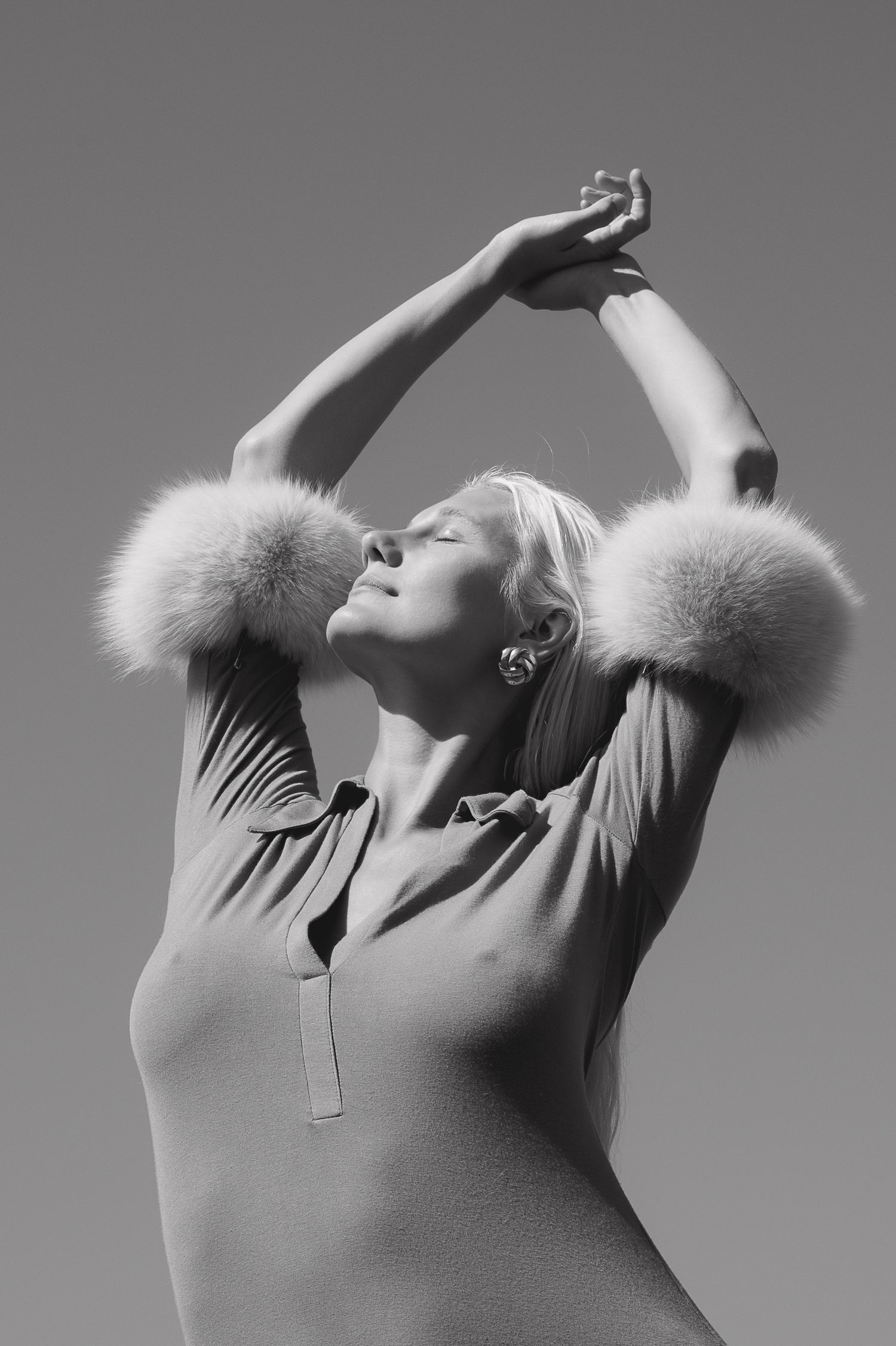 Artistic black and white fashion series featuring fur details and dramatic poses.