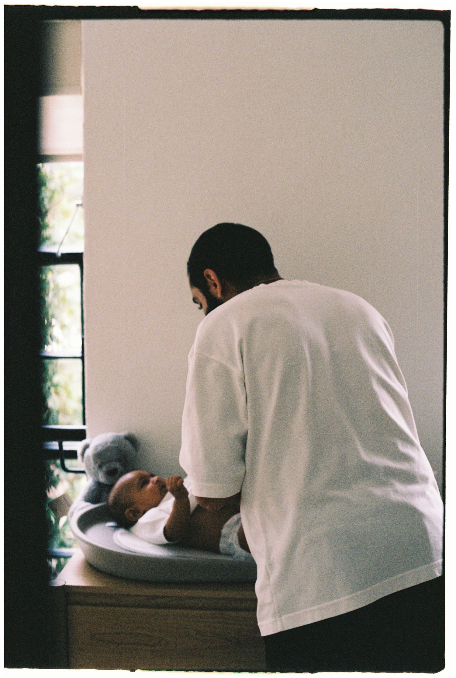 Documentary style photographs showing quiet moments of infant care.