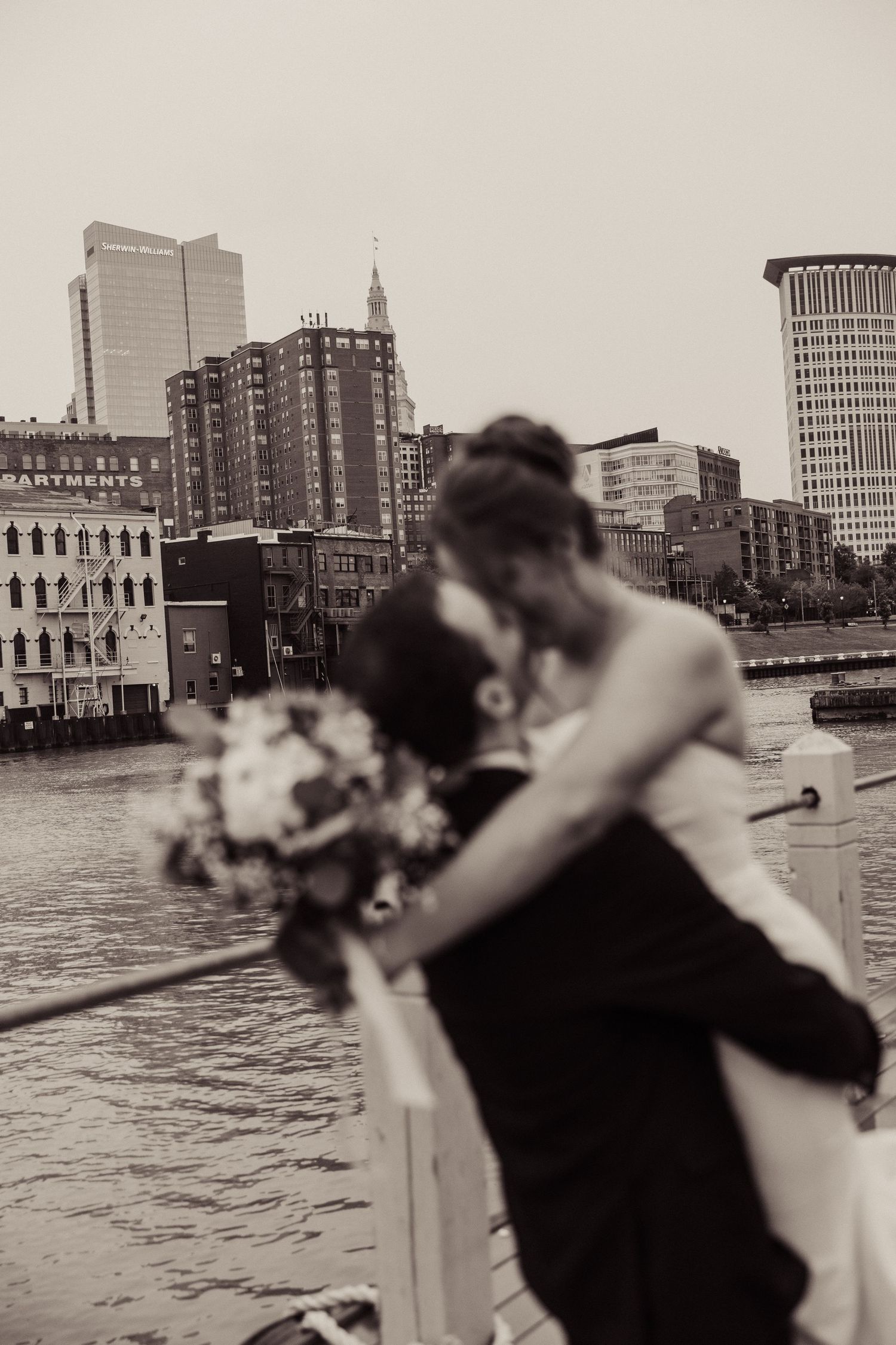 Artistic black and white cityscape wedding photos with waterfront views.