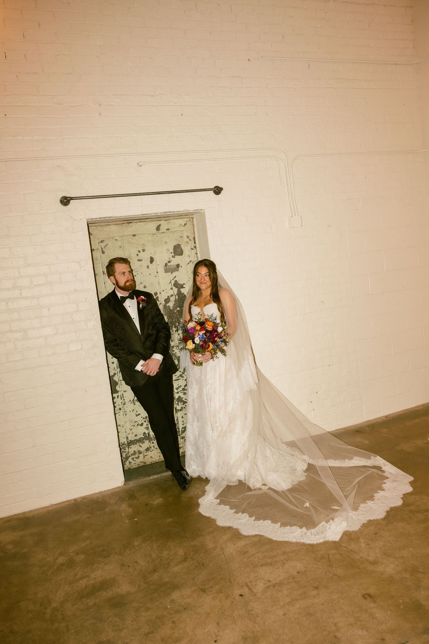 A romantic wedding photo sequence showing a couple posing against a white brick wall in a vintage sepia tone style.
