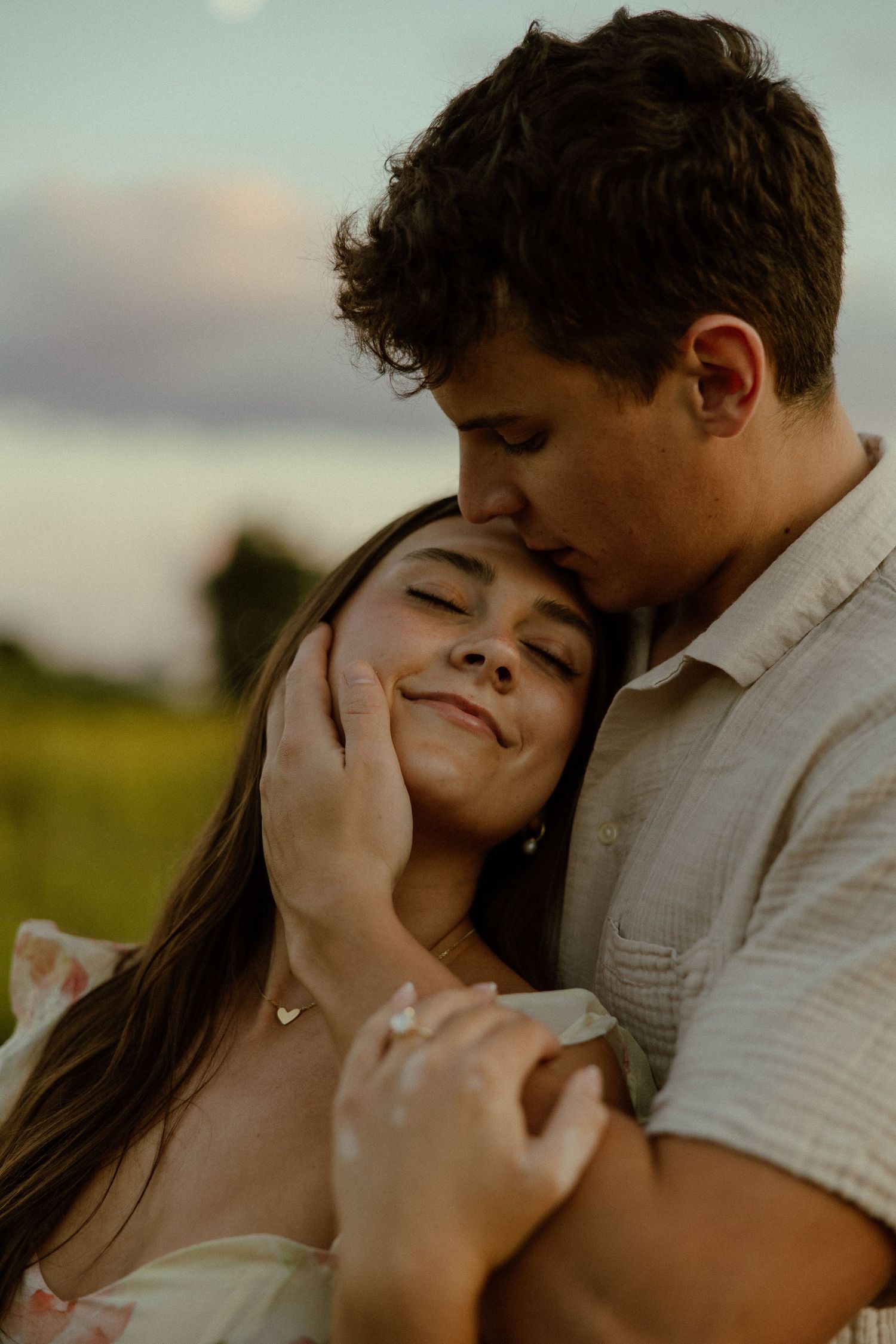 Romantic couple sharing tender intimate moments in a series of close-up photos outdoors at sunset.