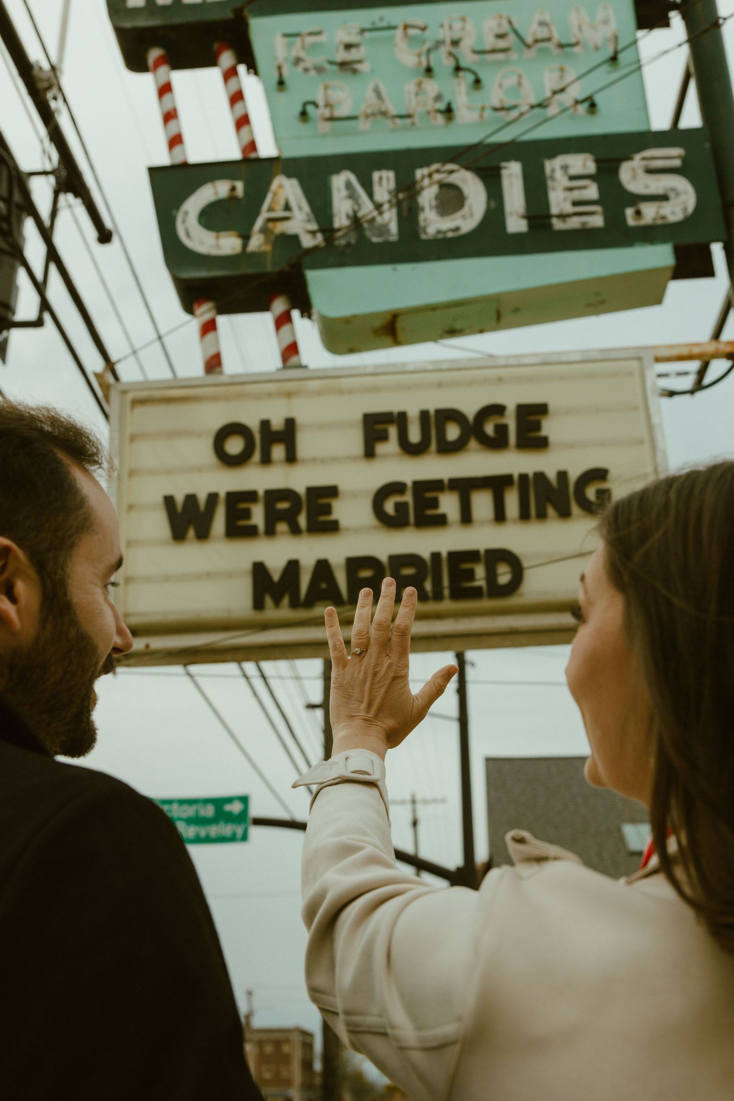 Vintage candy shop sign with retro lettering and striped design elements in a nostalgic storefront display.