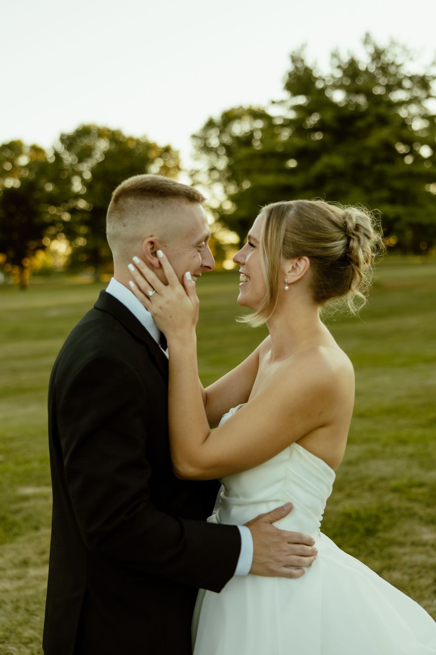A romantic sunset wedding photo sequence showing tender moments between newlyweds in an outdoor setting.