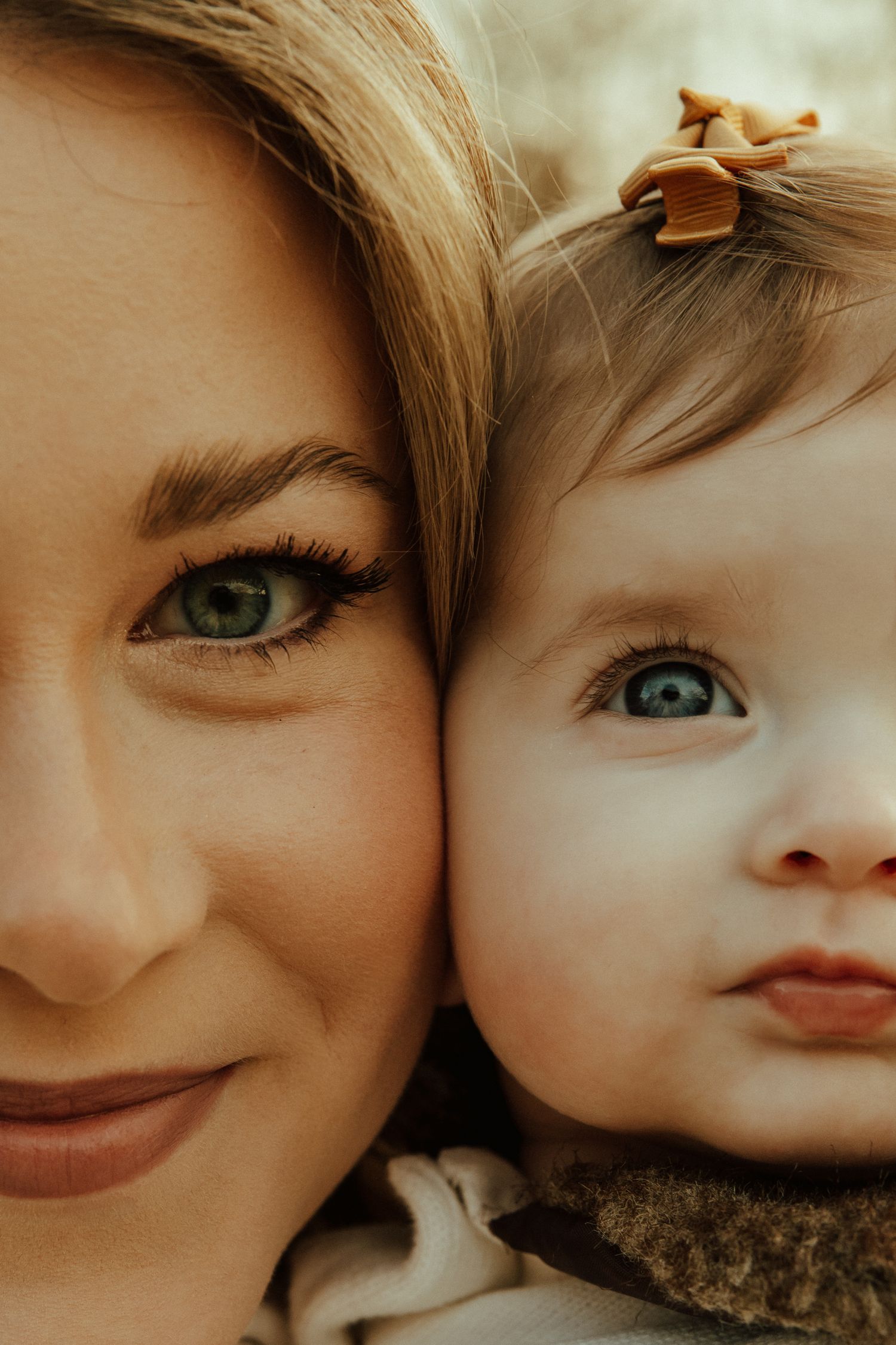 Close-up portrait series showing intimate parent-child moments with soft, warm lighting.