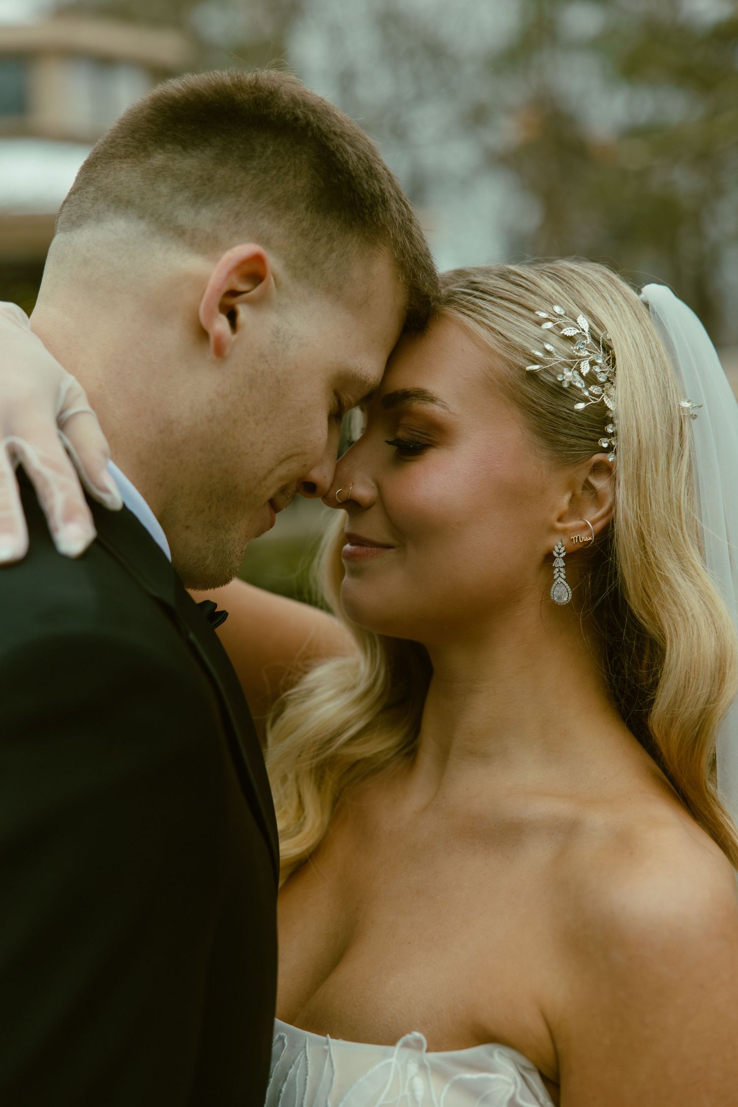 A romantic wedding couple shares an intimate moment together during their special day.