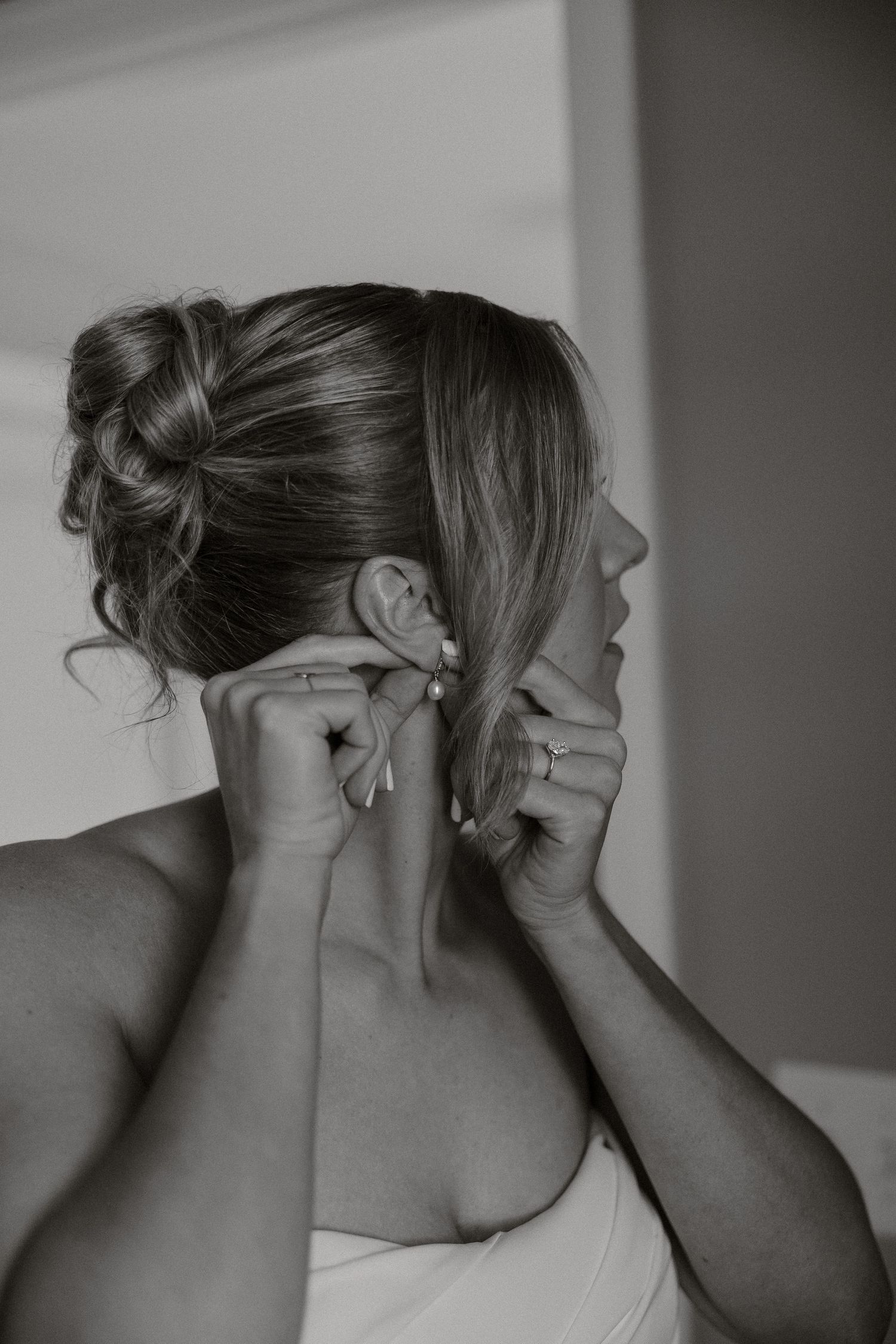 Series of black and white photos showing a hairstyling sequence with an updo being created.