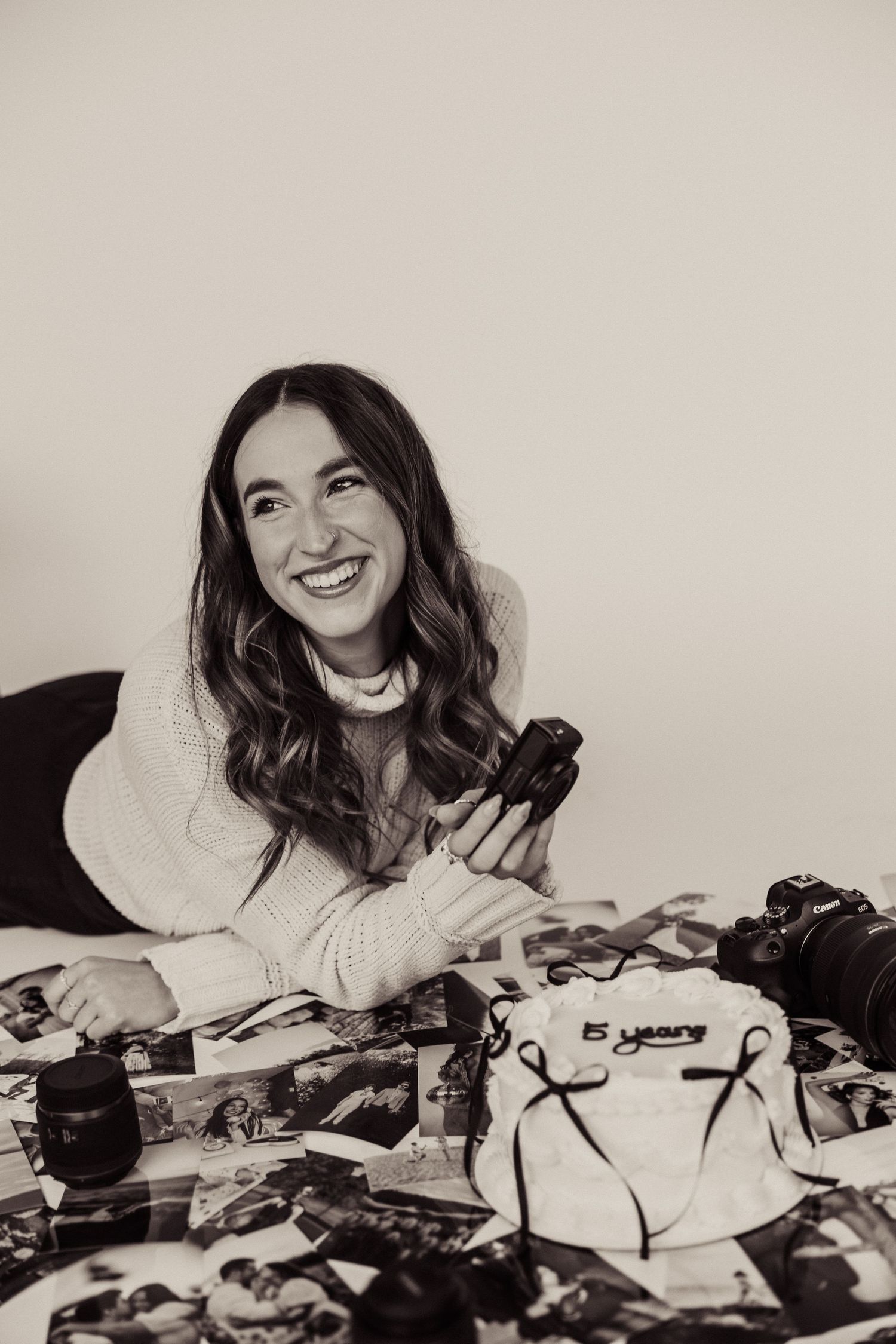A joyful moment captured with photography equipment and a relaxed casual setting.