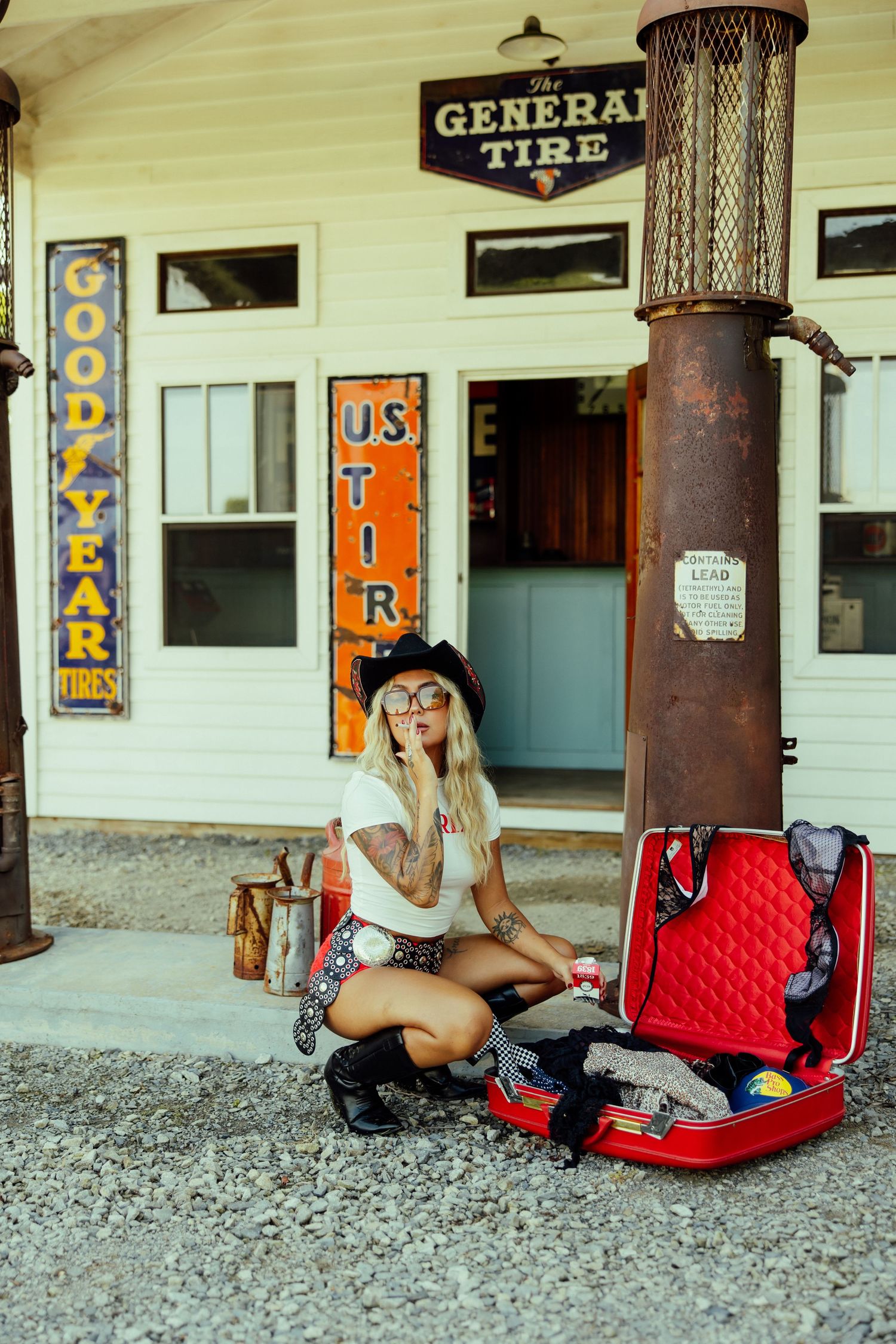 Retro scene at a vintage General Tire store with luggage and classic Americana decor.