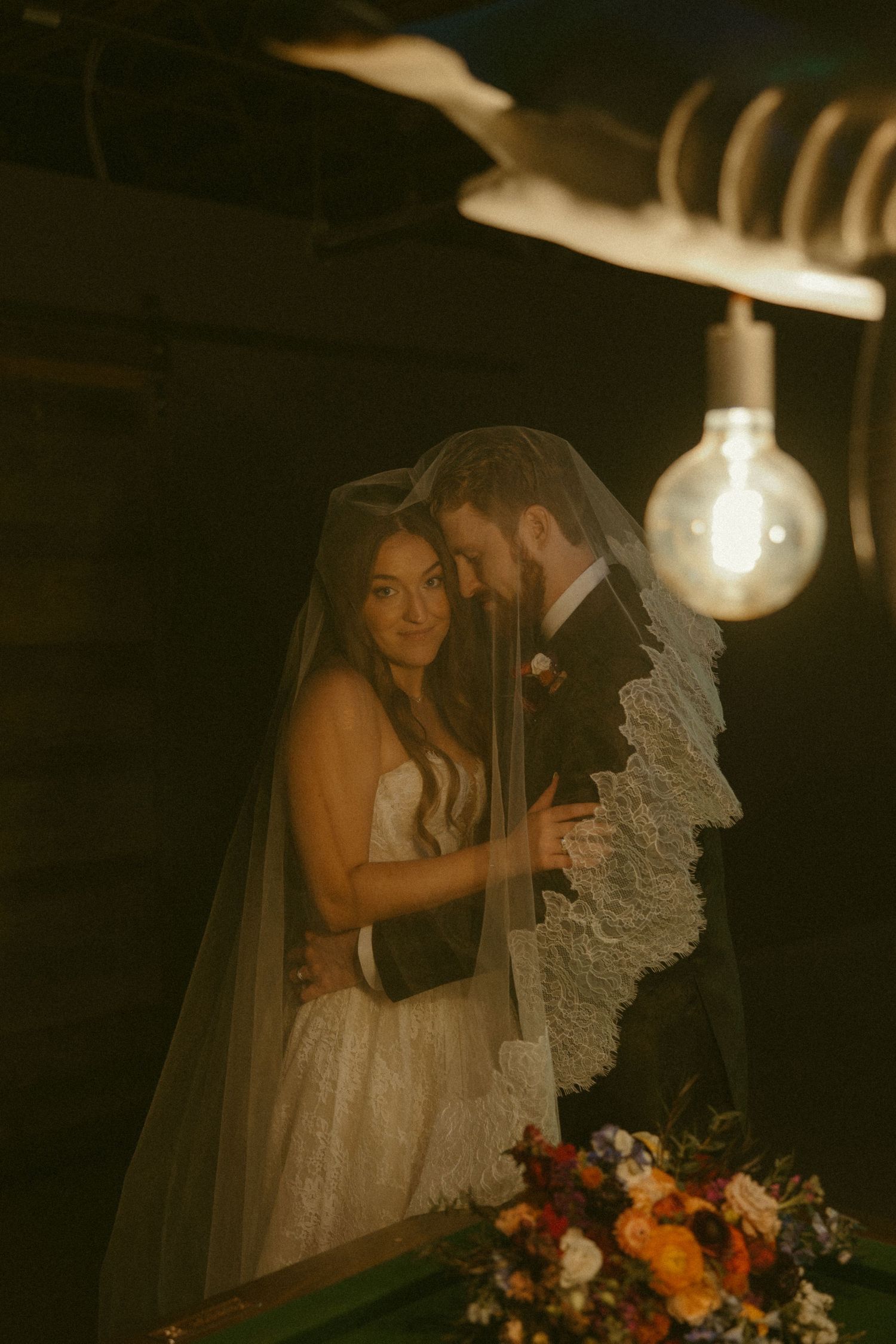 Romantic wedding photography sequence with moody lighting showing couple with lace veil and floral bouquet.
