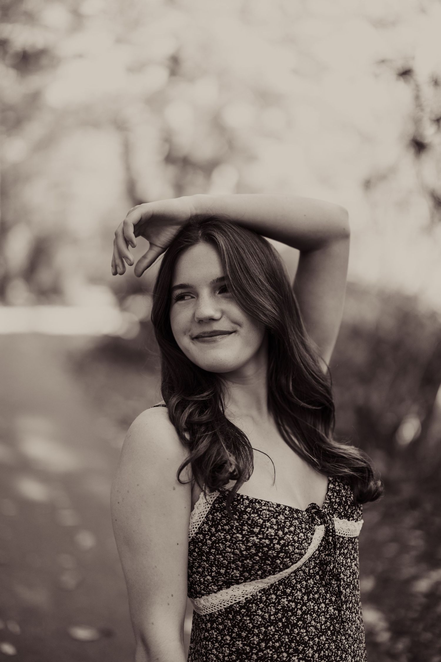 Black and white vintage style portrait with soft bokeh background.