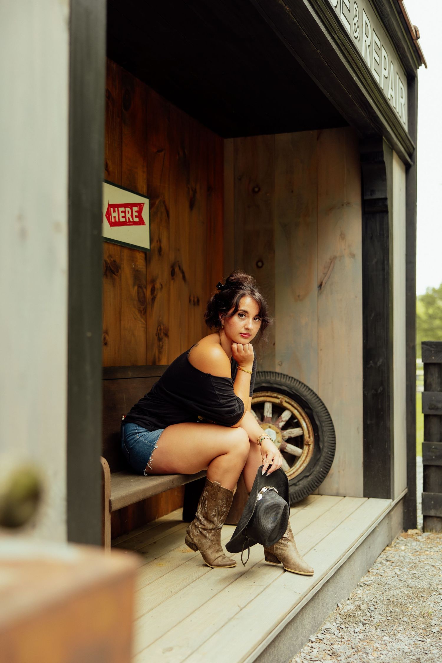 Vintage automotive scene with tire and wooden garage door setting.