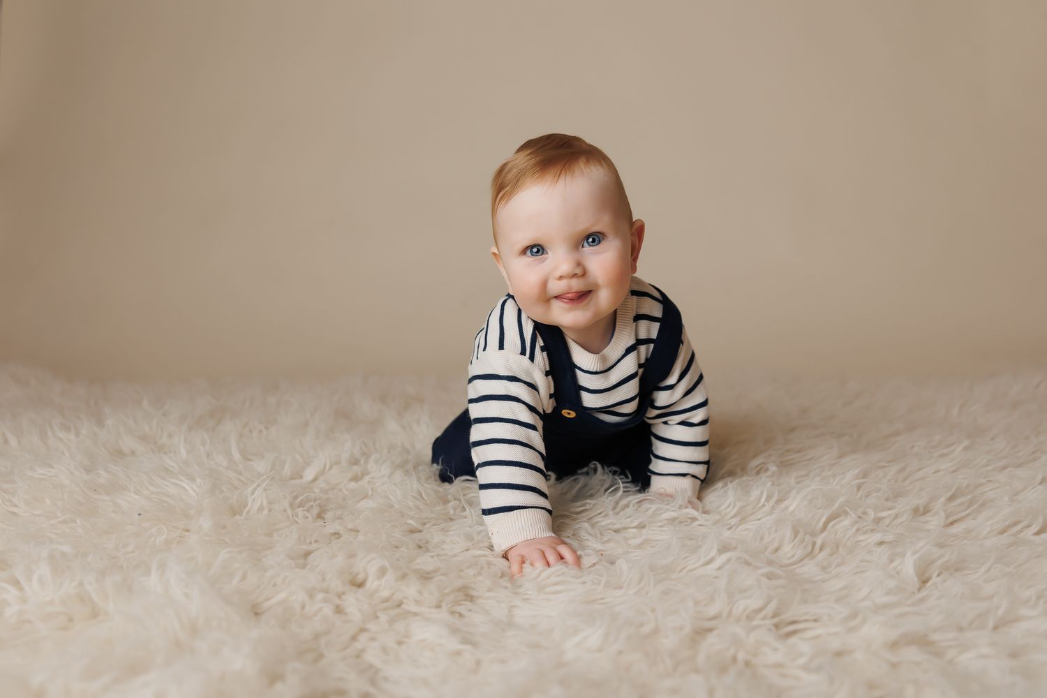 sitter aged baby crawling on a soft textured rug