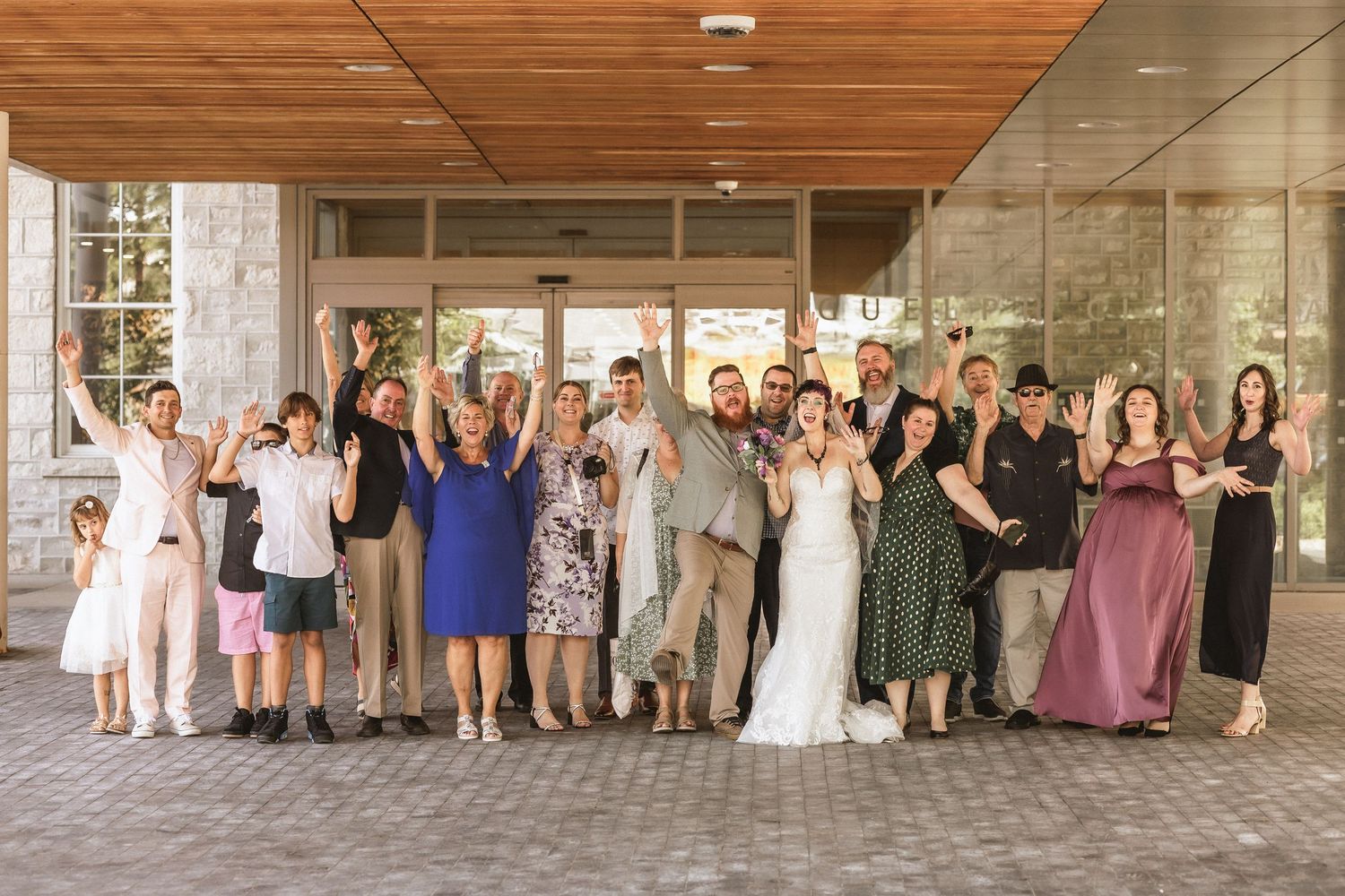 Group shot of guests celebrating the marriage of bride and groom