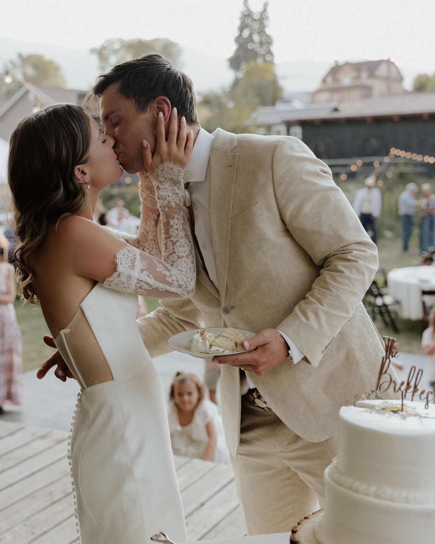 A tender wedding cake feeding moment between newlyweds on their special day.