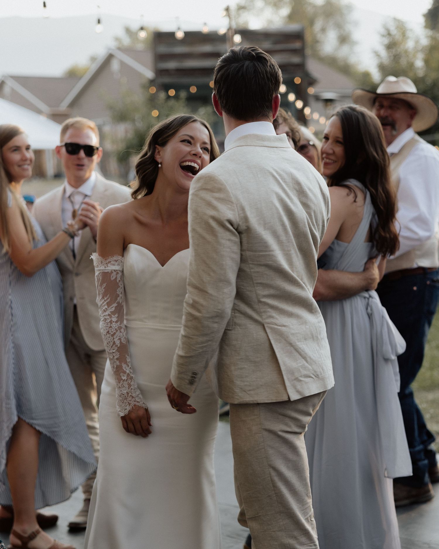 Candid moment of joy captured during wedding reception dancing.