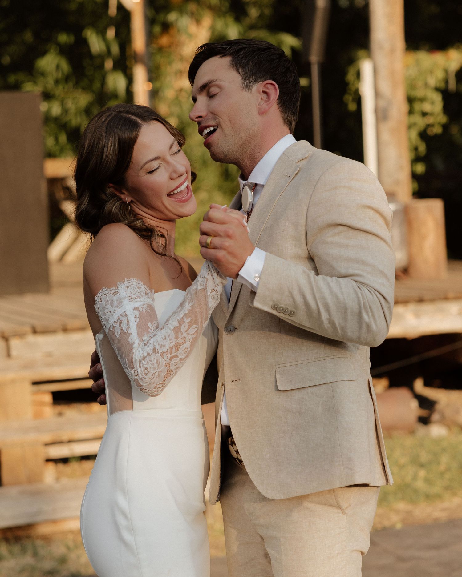 A couple sharing a joyful moment together during their wedding celebrations.