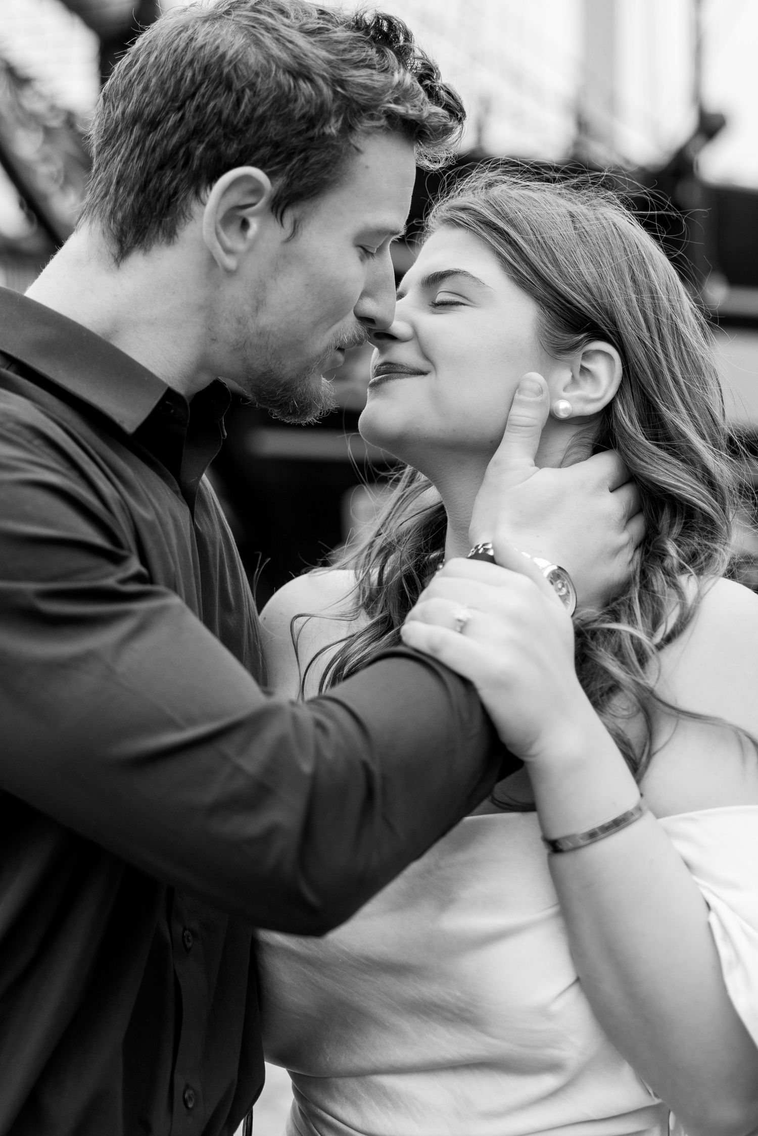 Intimate black and white close-up portrait of a tender moment.