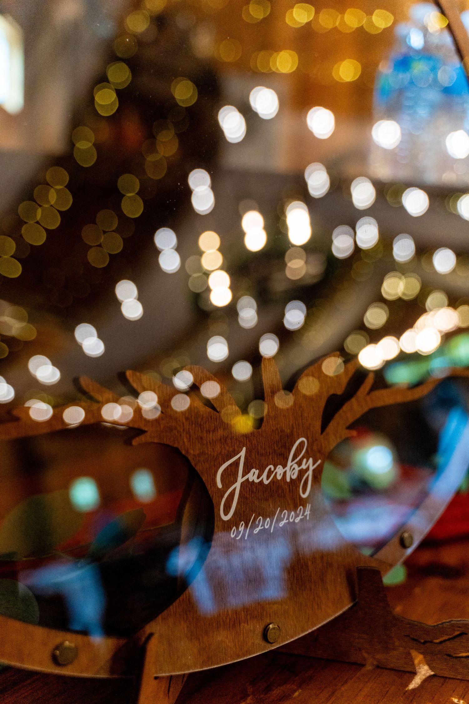 Wedding date inscription with bokeh lights creating romantic atmosphere.