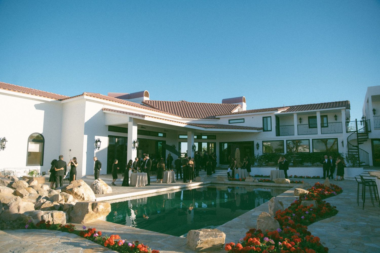 Mediterranean-style venue with swimming pool and outdoor seating area.