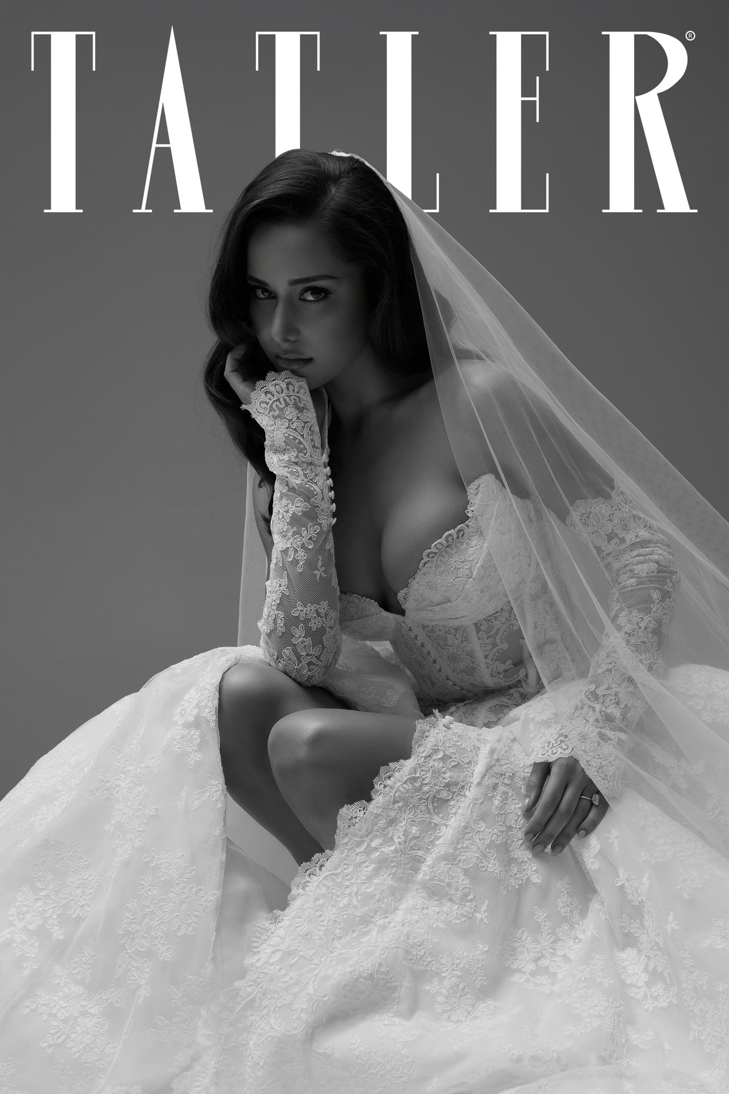Tatler magazine cover featuring bride in lace ballgown and veil in black and white portrait.