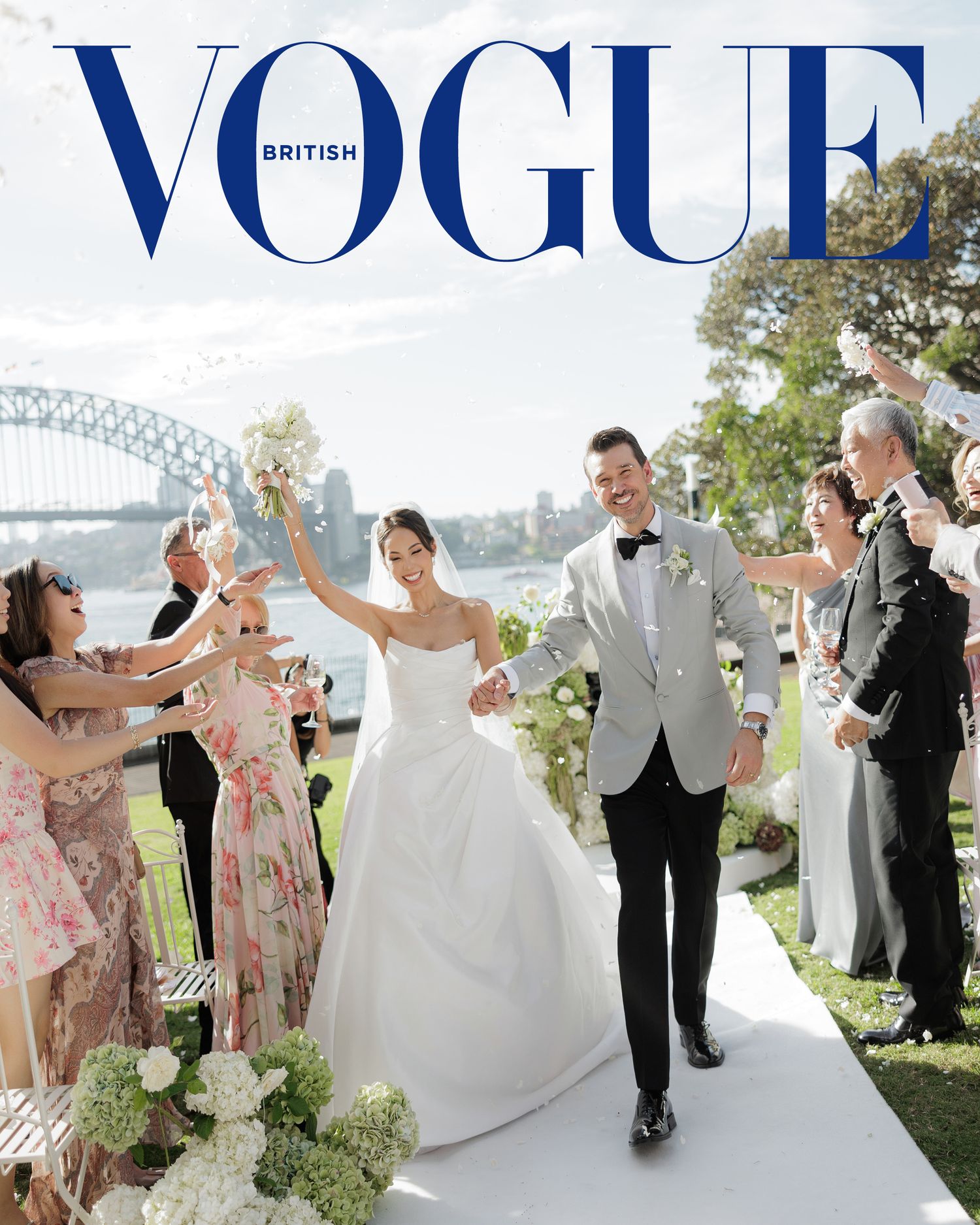 British Vogue wedding cover featuring couple celebrating on aisle with Sydney Harbour Bridge backdrop.