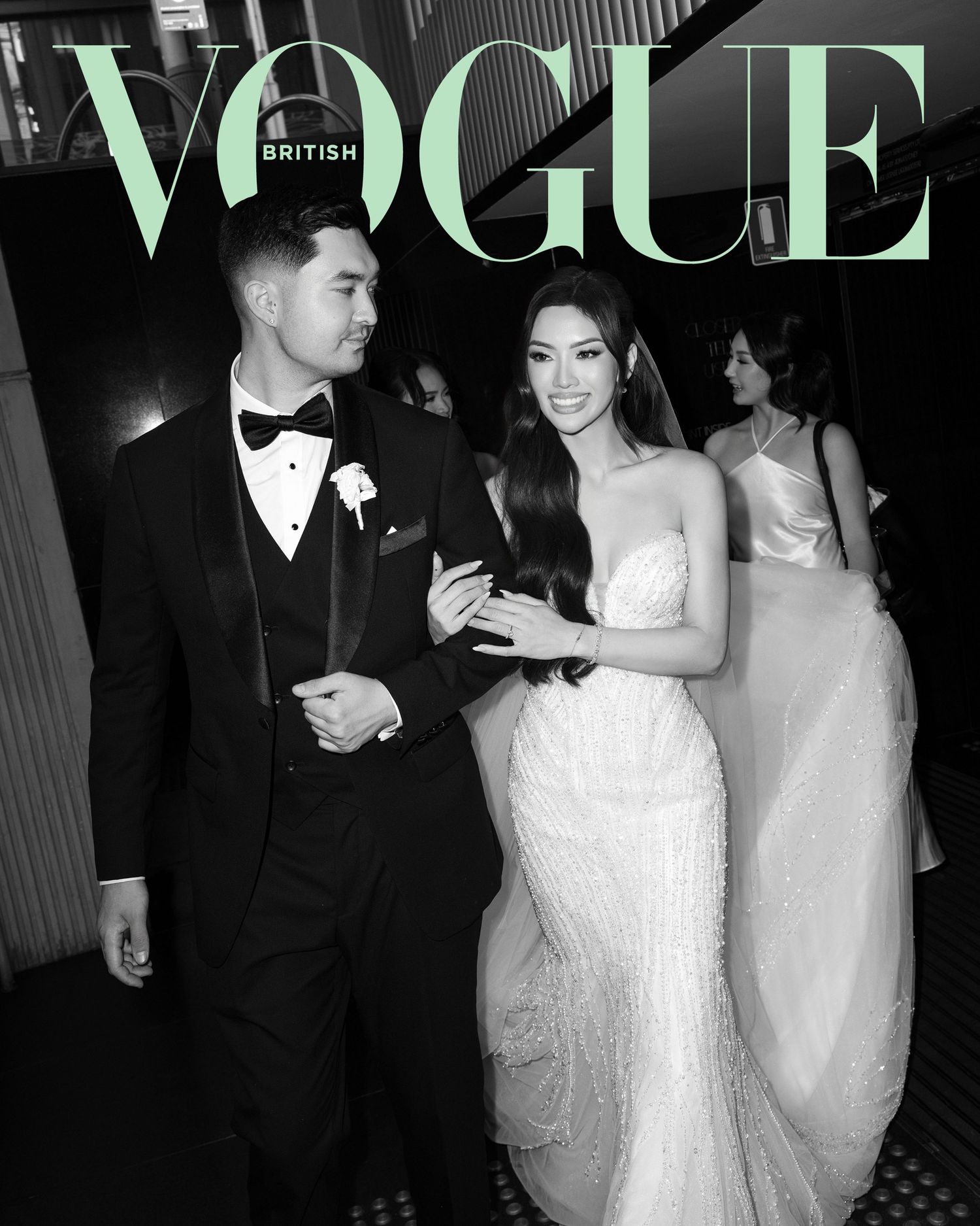 Black and white British Vogue wedding cover featuring bride in strapless gown with groom in tuxedo.