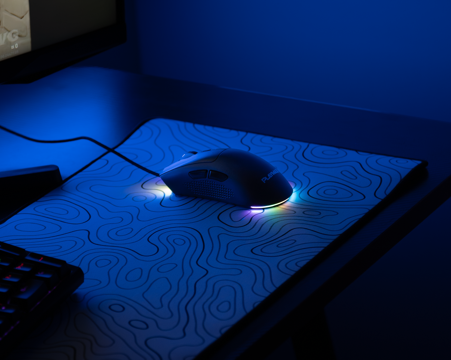 RGB gaming mouse on a topographic-patterned mousepad glowing in a blue-lit gaming setup.