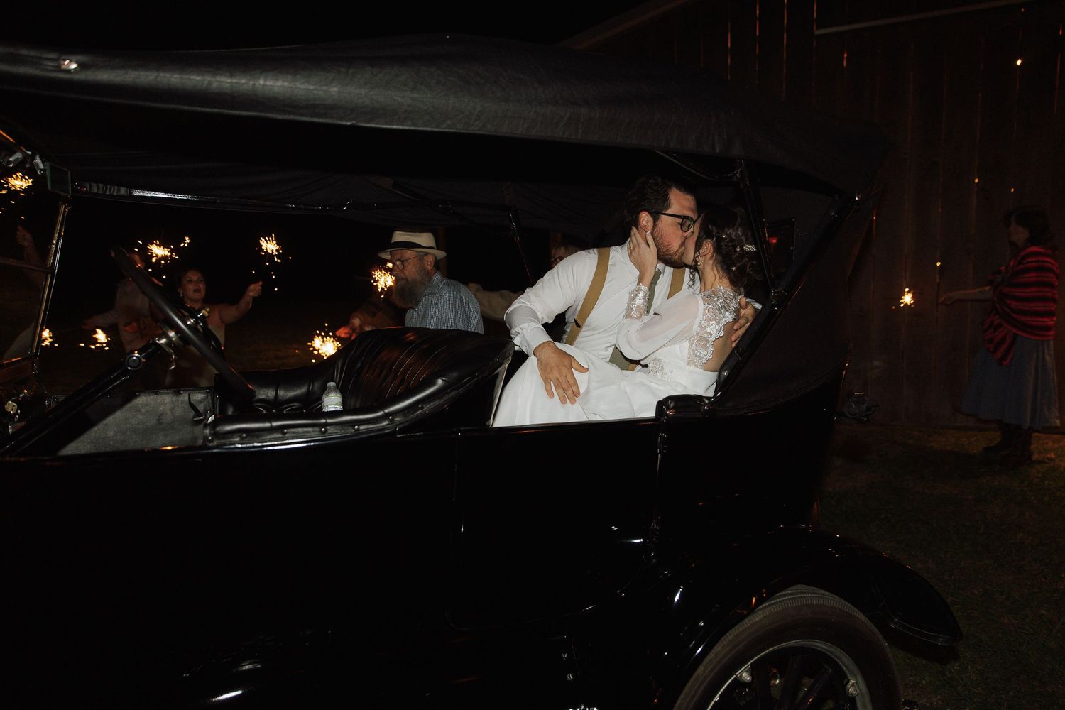 Dark atmospheric nighttime wedding photos with classic car silhouettes.