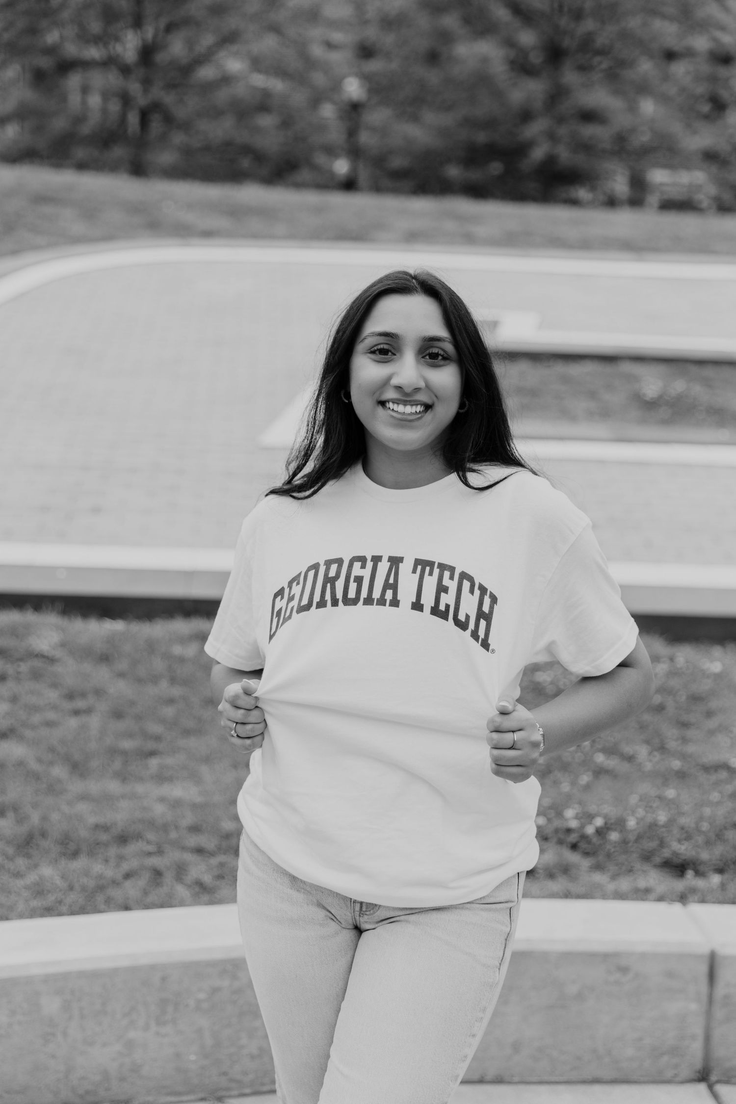 Student wearing Georgia Tech apparel poses for casual outdoor photos.