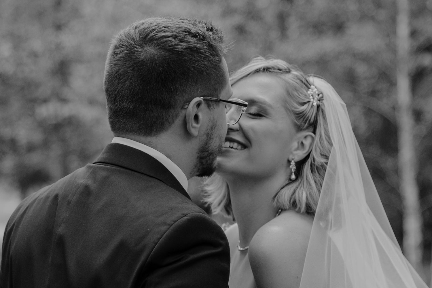 Romantic black and white wedding photography sequence showing tender moments between bride and groom.